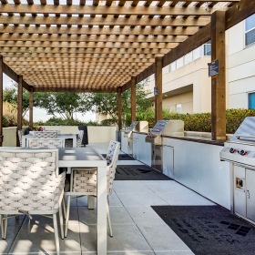 Outdoor wooden pavilion with grills and tables with chairs Outdoor wooden pavilion with grills and tables with chairs